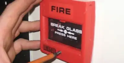 fire alarm installation service showing manual fire alarm pull station installed by licensed electricians in St Paul, MN