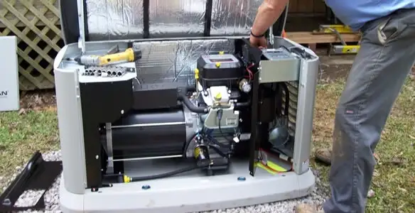 generator installation service showing technician connecting and configuring generator components in St Paul, MN