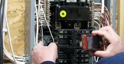 Home electrical inspection of circuit breaker panel by licensed electrician in St Paul, MN
