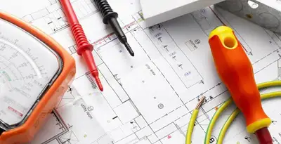 licensed electrician planning and testing electrical systems using professional tools in St Paul, MN