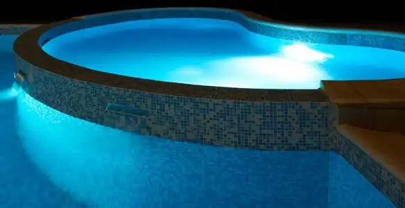 pool light installation and repair services highlighting illuminated pool interior lighting in St Paul, MN