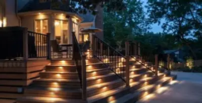 Residential electrician installing outdoor lighting for home safety in St Paul, MN
